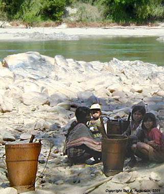 Montagnard (Jarai) children with baskets, by river in Central Highlands, Vietnam, 2000
