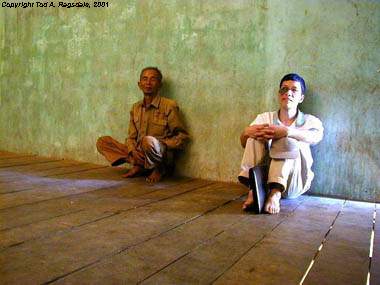 Montagnard (Jarai) villager and Vietnamese (Kinh) academician during village social survey...